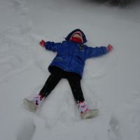 Poppy as a snow angel