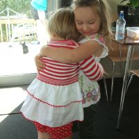 Poppy hugs Ayla