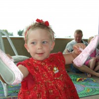 Poppy opens her gift from Santa - ballet shoes!
