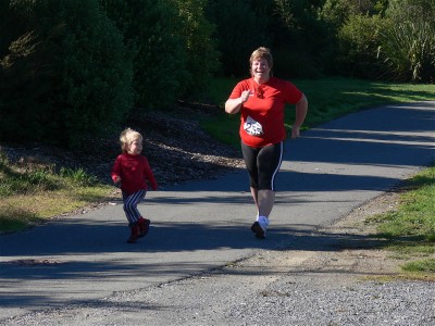 Poppy joins Mummy near the end of the Nelson Quarter Marathon race
