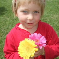 The flower seller gave Poppy some blooms