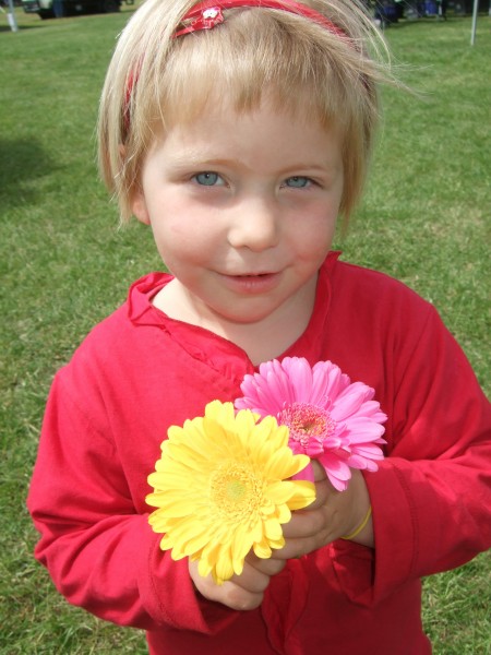 The flower seller gave Poppy some blooms