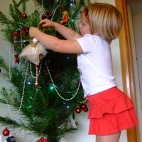 Poppy puts her angel on the tree