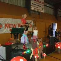 Kath Bee singing with Poppy on stage