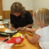 Signing her name on the paperwork