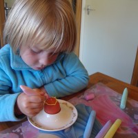 Decorating her eggs