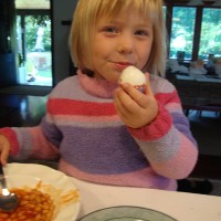 Eating her decorated egg for lunch