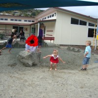 Playing in the sandpit at intermission with E.