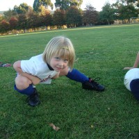 Stretching at football practice