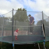Koji jumping on the tramp with Poppy