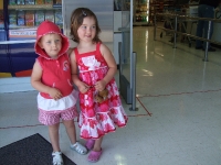 Poppy & Phoebe helping shop for our food list at the grocery store the day before we leave
