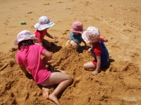 Burying Poppy in the sand