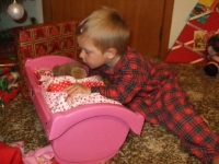 Putting Honey to bed in a new cot from Santa