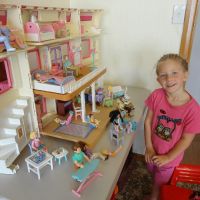 Playing with dolls house