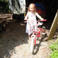 Mummy provides a farm bike to practice riding