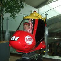 Playing on the helicopter at Auckland airport