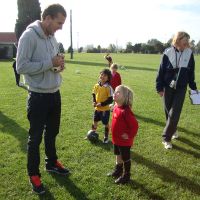 Signing Poppy\'s autograph ball