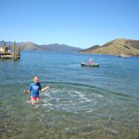 Poppy & Shanni in the boat with Mahalia swimming