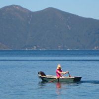 Shanni rowing out with the cat to catch fish