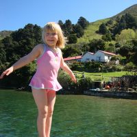 Poppy on the jetty with the Shand homestead in the background