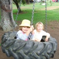 Charlee & Poppy on the tyre swing
