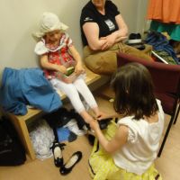 Xan helping Poppy in the dressing room